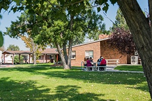Riverdale Post Acute facility grassy outdoor area